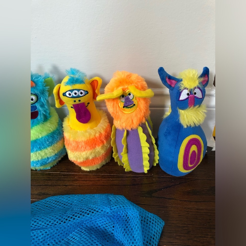 Melissa & Doug 8-Piece Fuzzy Monster Bowling Pin and Ball Set w/Mesh Storage Bag - Picture 3 of 6